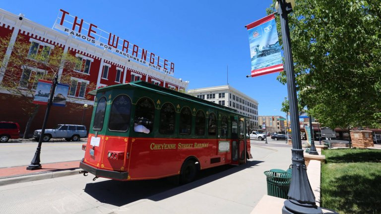 downtown trolley in front of building